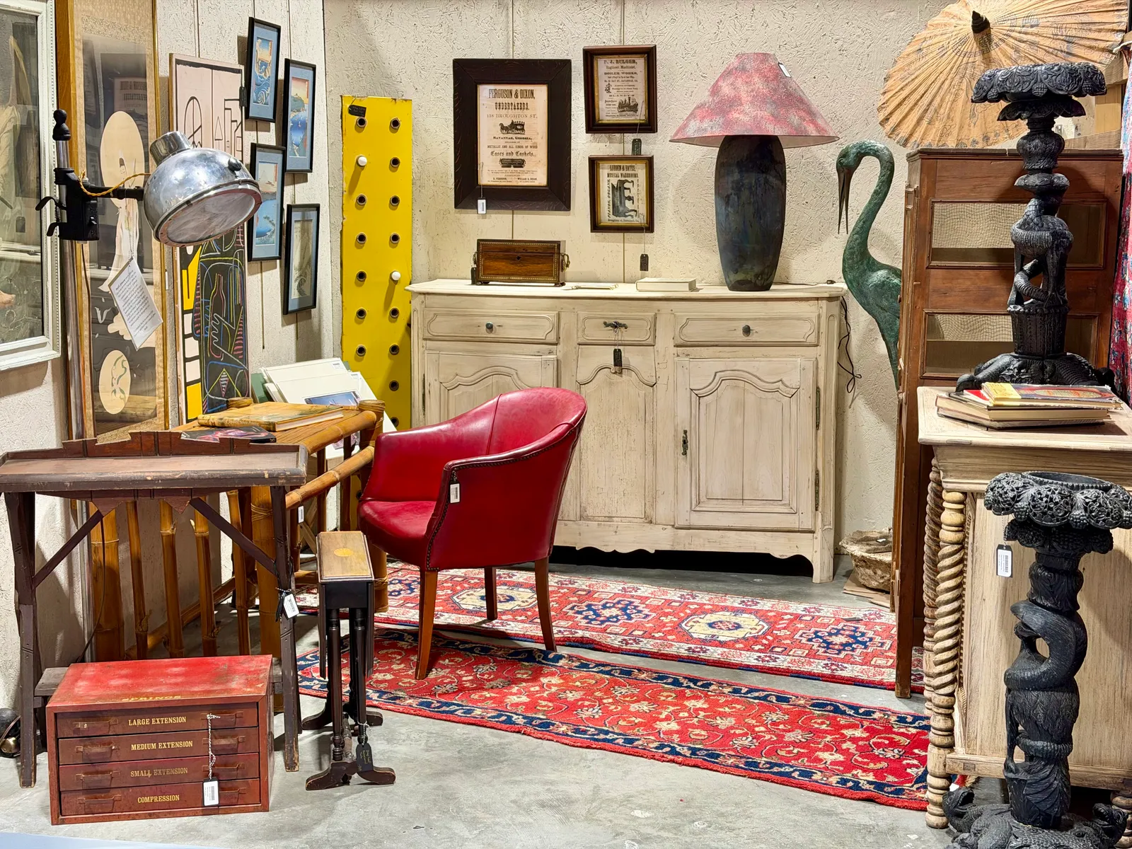 A red leather chair and a French sideboard
