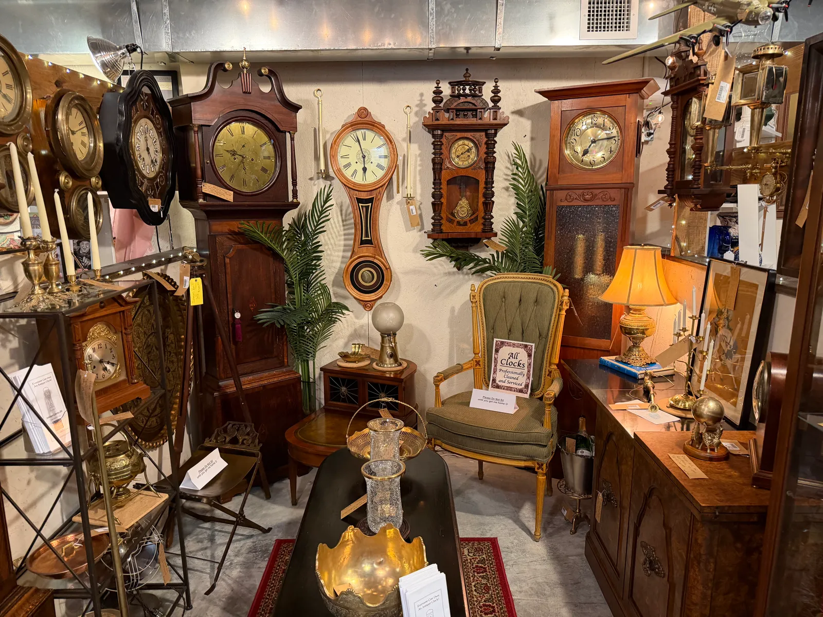 The clock room: grandfather clocks and wall clocks around an armchair